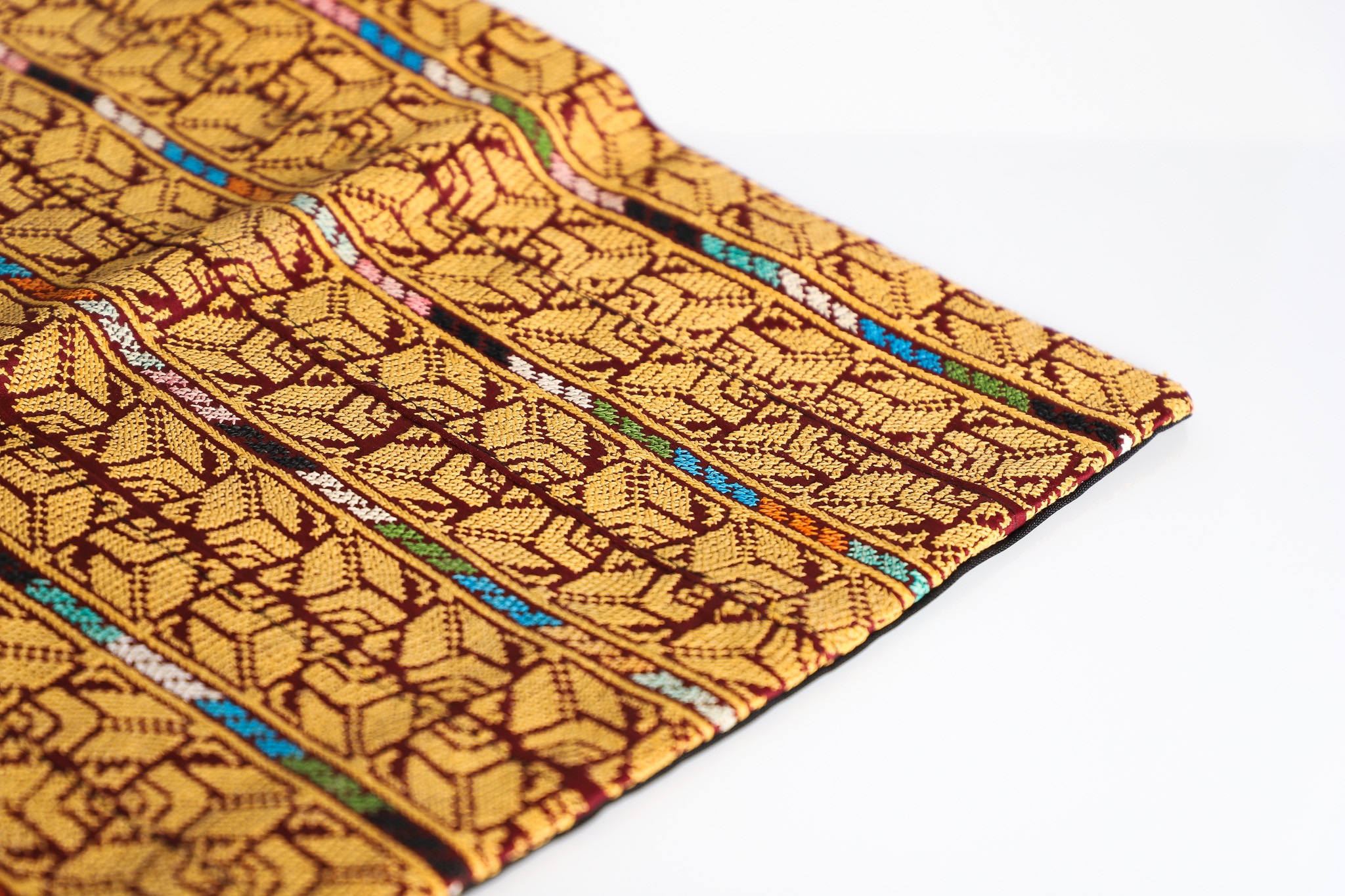 Golden Heritage– A Hand-Embroidered Palestinian Cushion